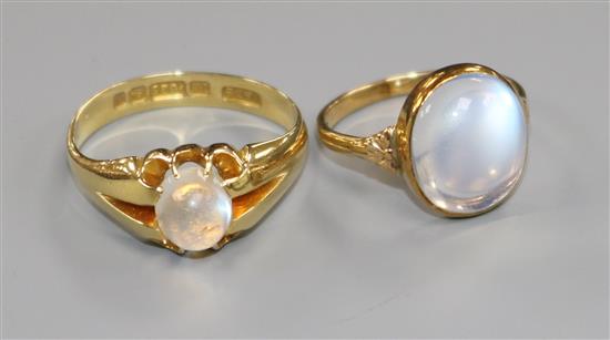 An Edwardian 15ct gold and claw set moonstone ring and a later 14k gold moonstone ring.